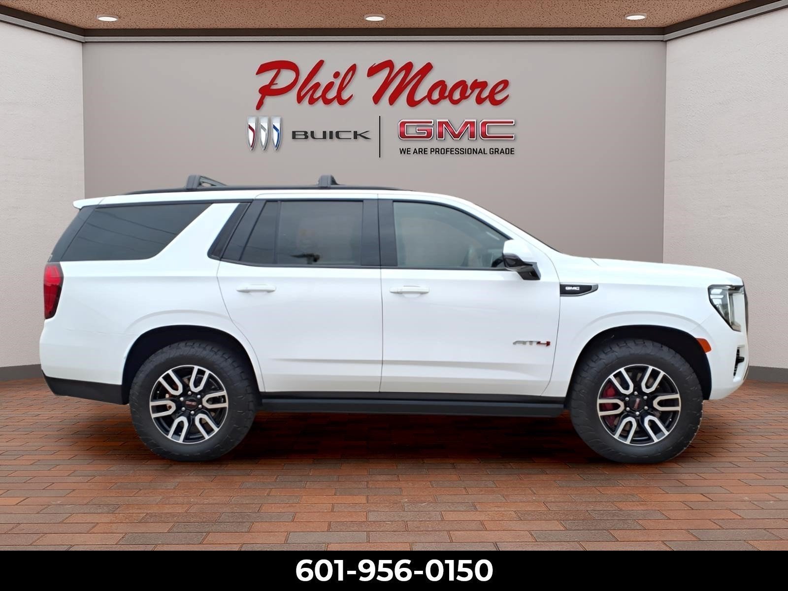 2024 GMC Yukon AT4 in Summit White — front three-quarter view