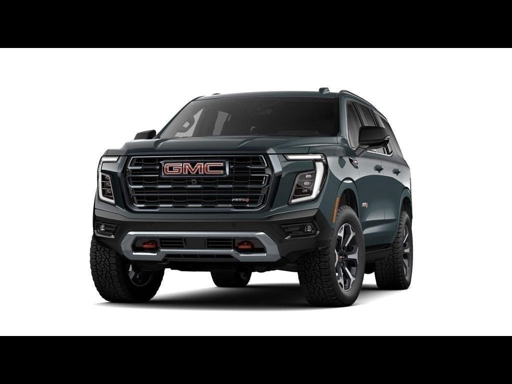 2026 GMC Yukon AT4 in Midnight Pine — front three-quarter view