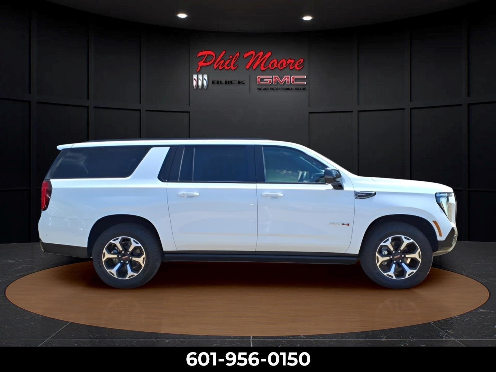 2026 GMC Yukon XL AT4 in Summit White — front three-quarter view