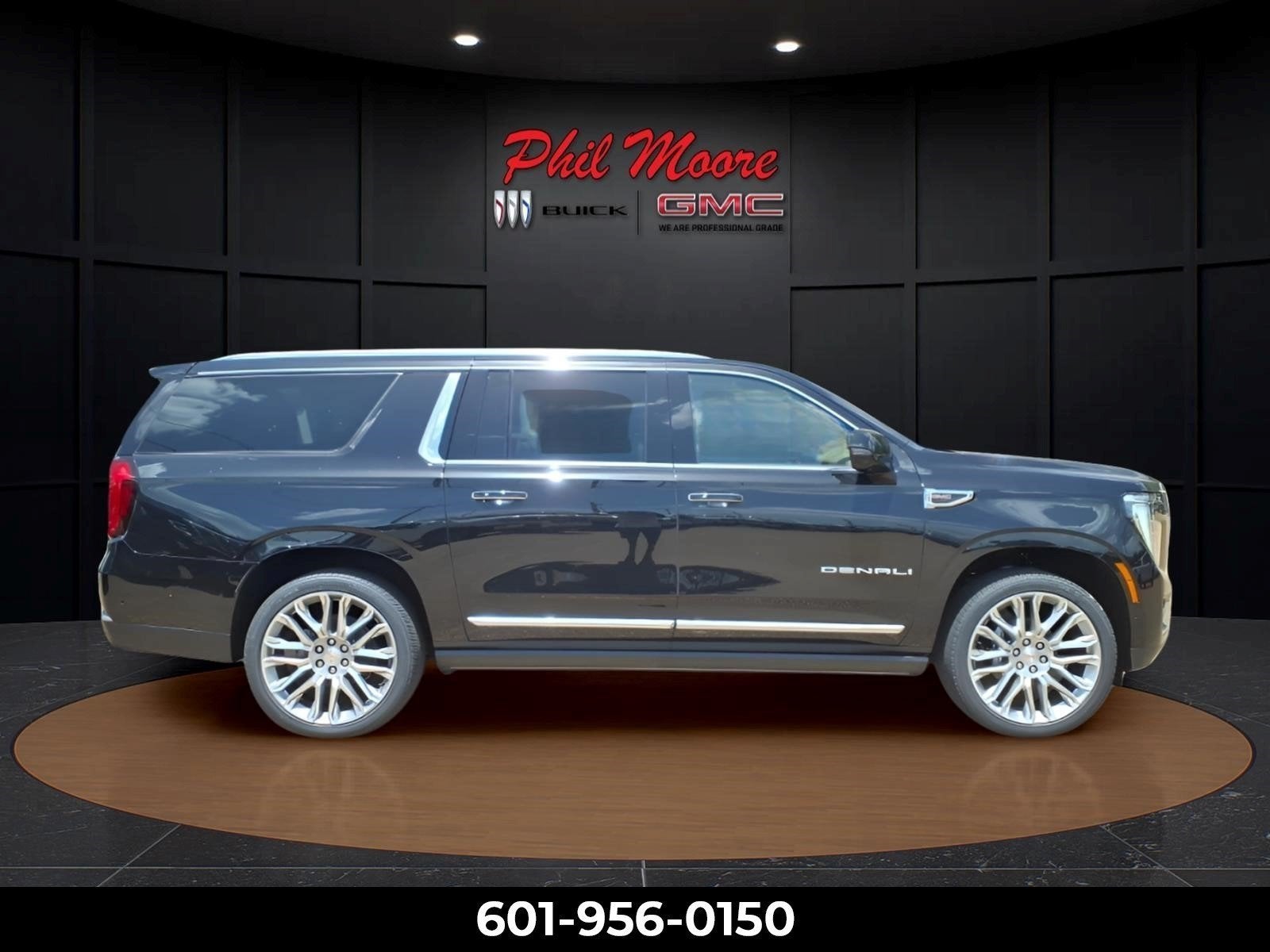 2026 GMC Yukon XL Denali in Onyx Black — front three-quarter view