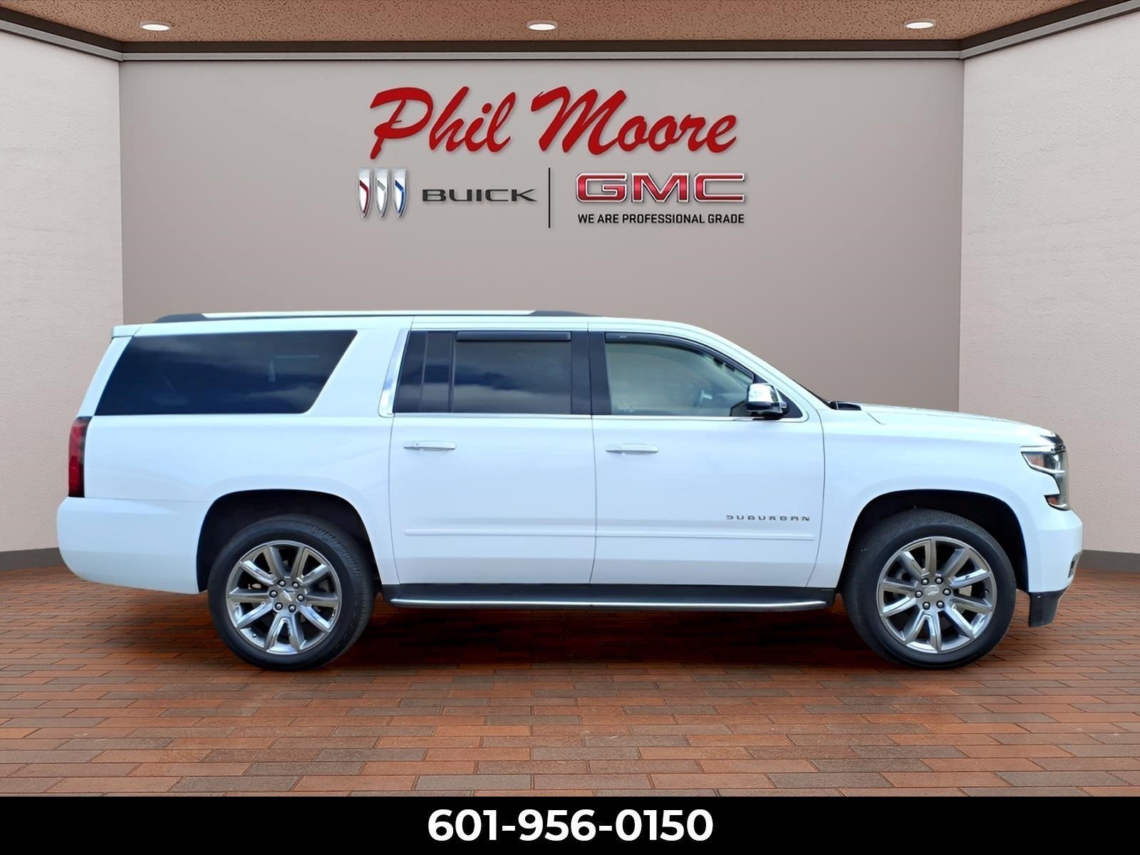 2017 Chevrolet Suburban Premier in Summit White — front three-quarter view