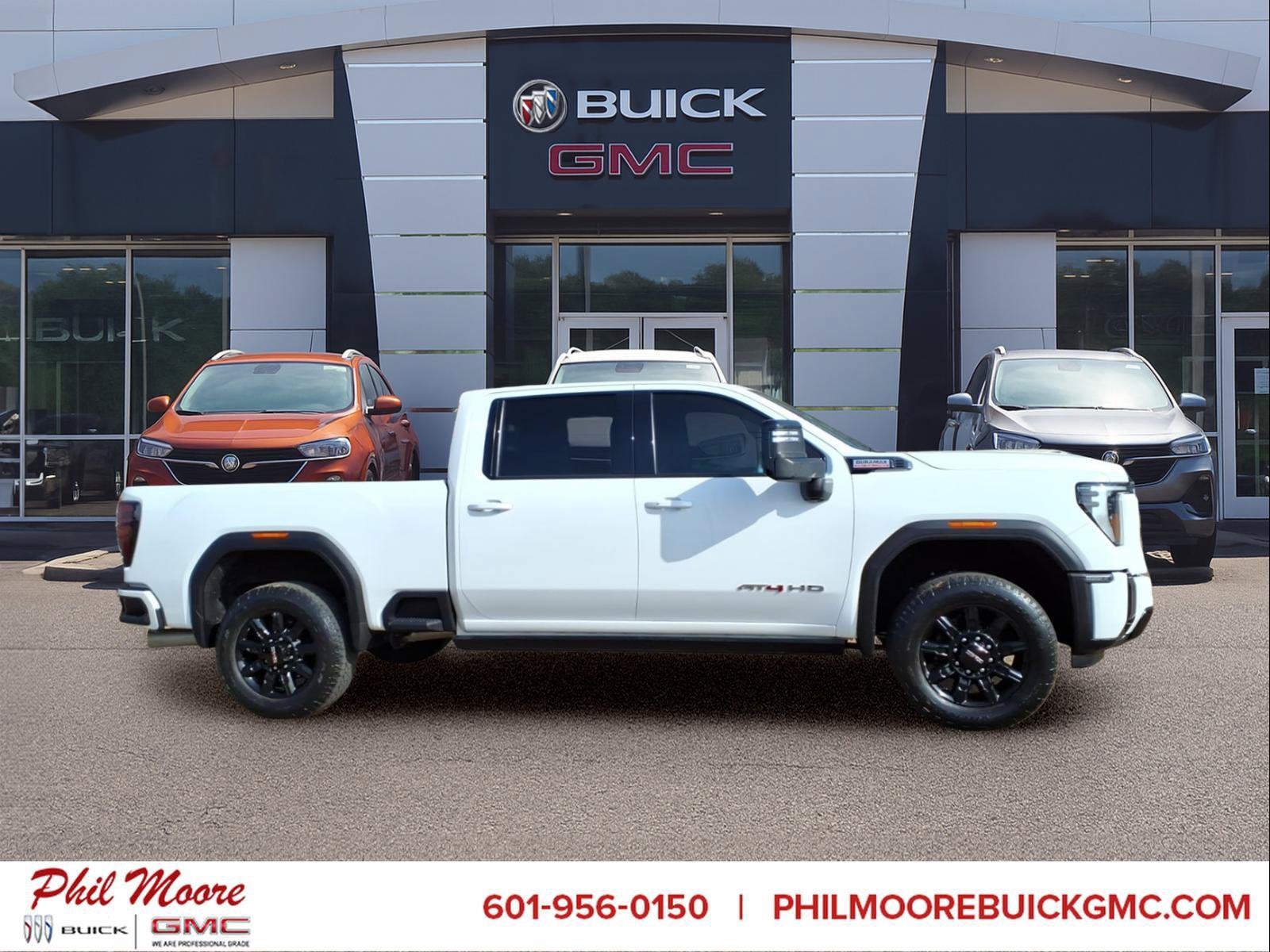 2024 GMC Sierra 2500 HD AT4 in Summit White — front three-quarter view
