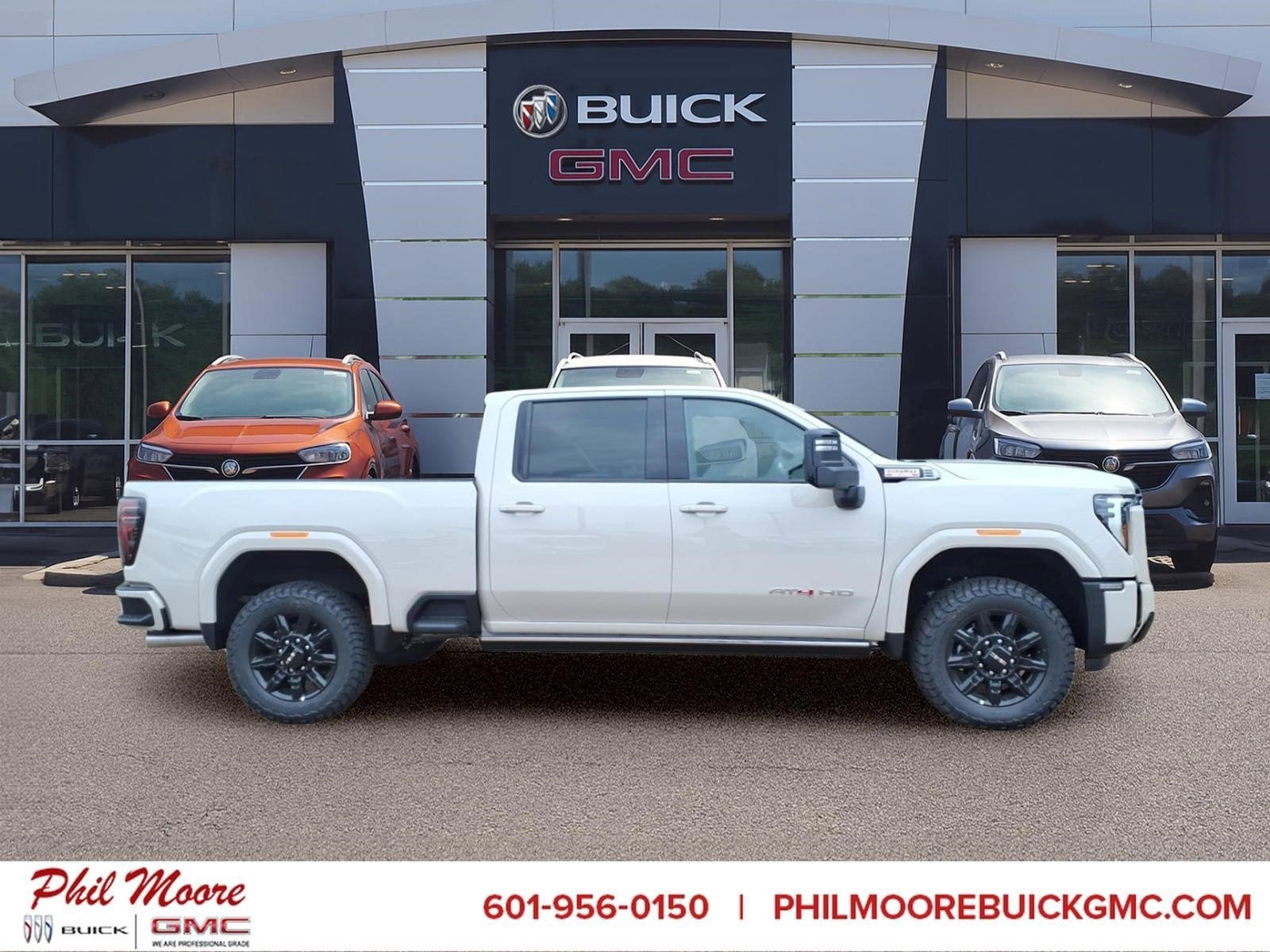 2026 GMC Sierra 2500 HD AT4 in Coastal Dune — front three-quarter view