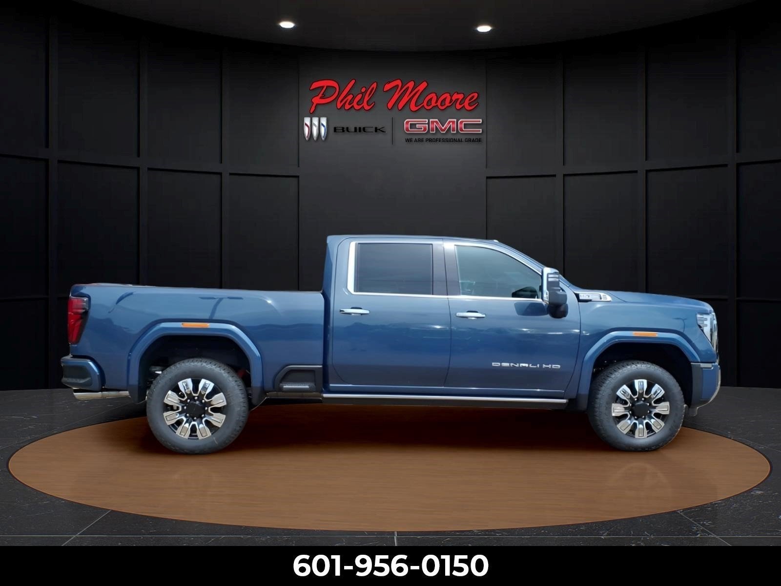 2026 GMC Sierra 2500 HD Denali in Downpour Metallic — front three-quarter view