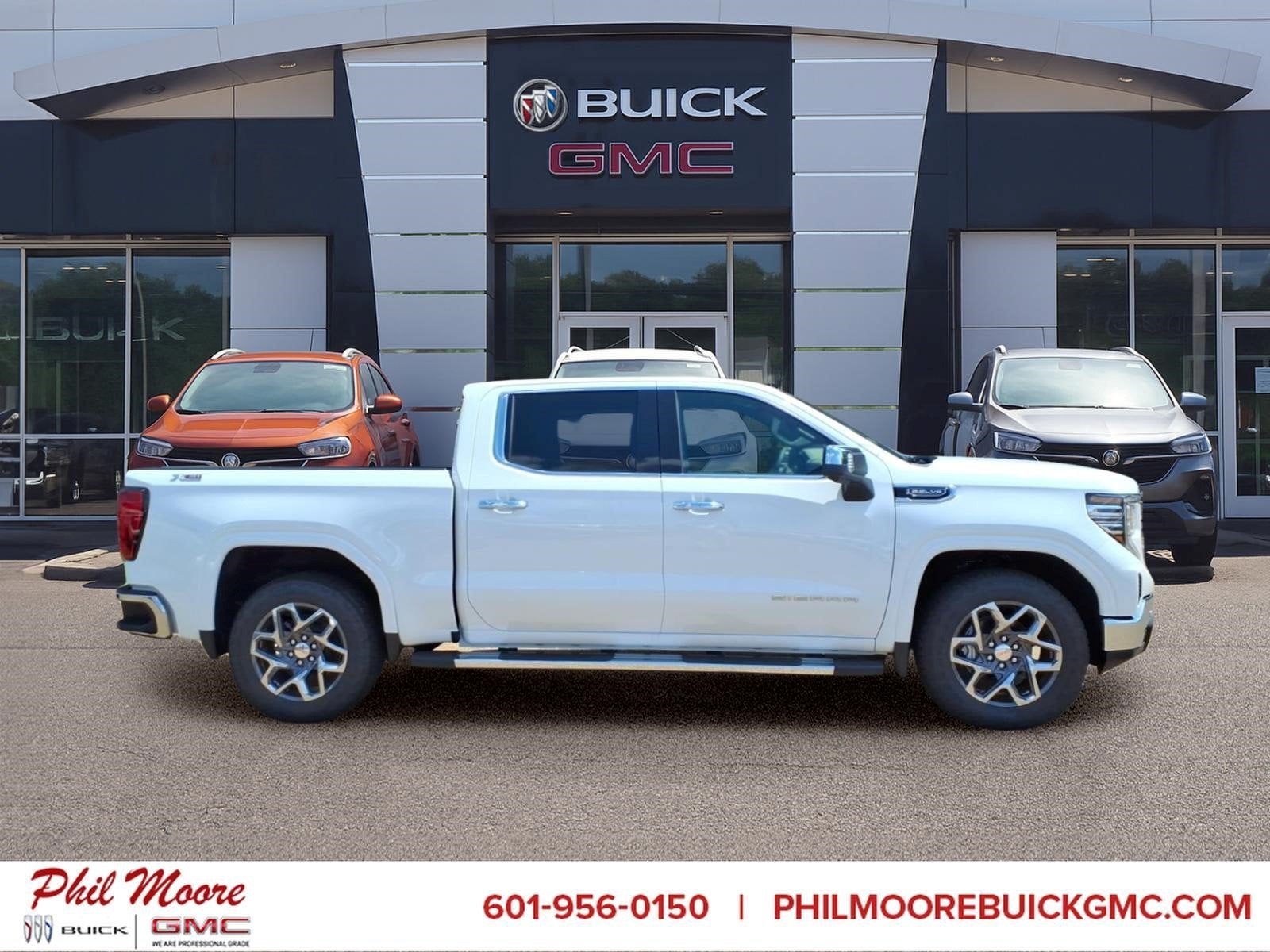 2026 GMC Sierra 1500 SLT in Summit White — front three-quarter view
