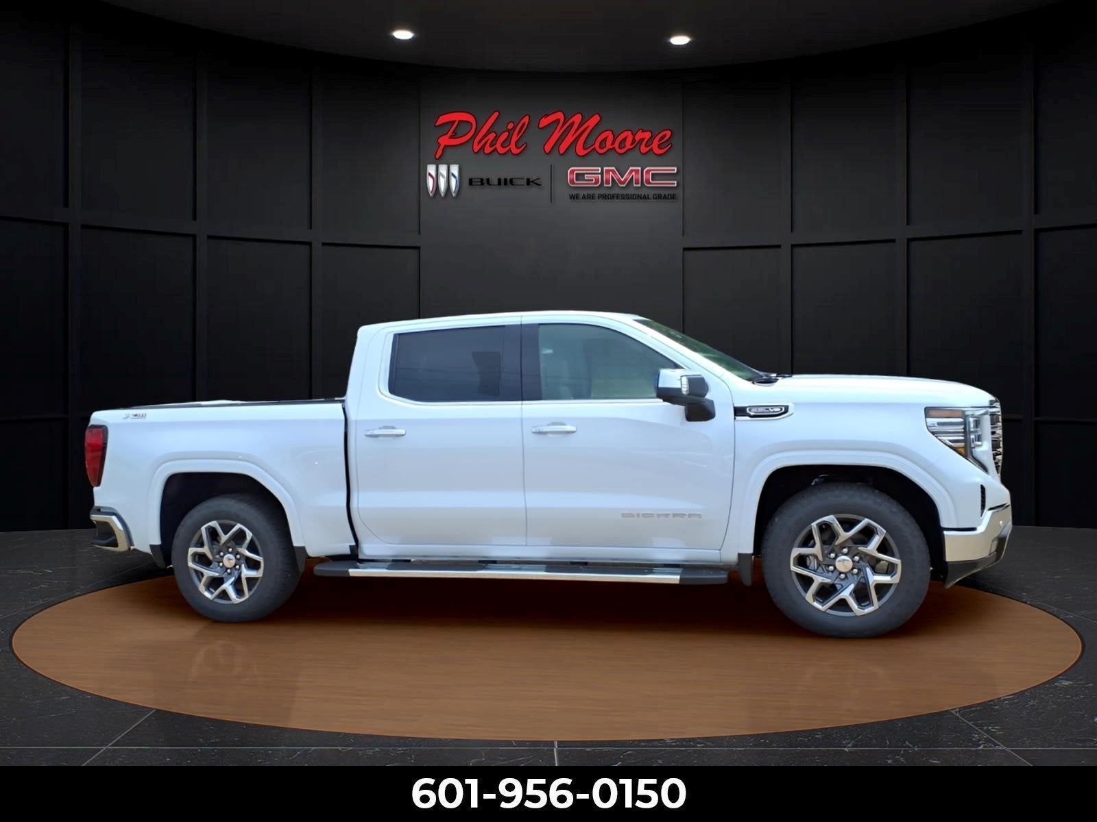 2026 GMC Sierra 1500 SLT in Glacier White Tricoat — front three-quarter view