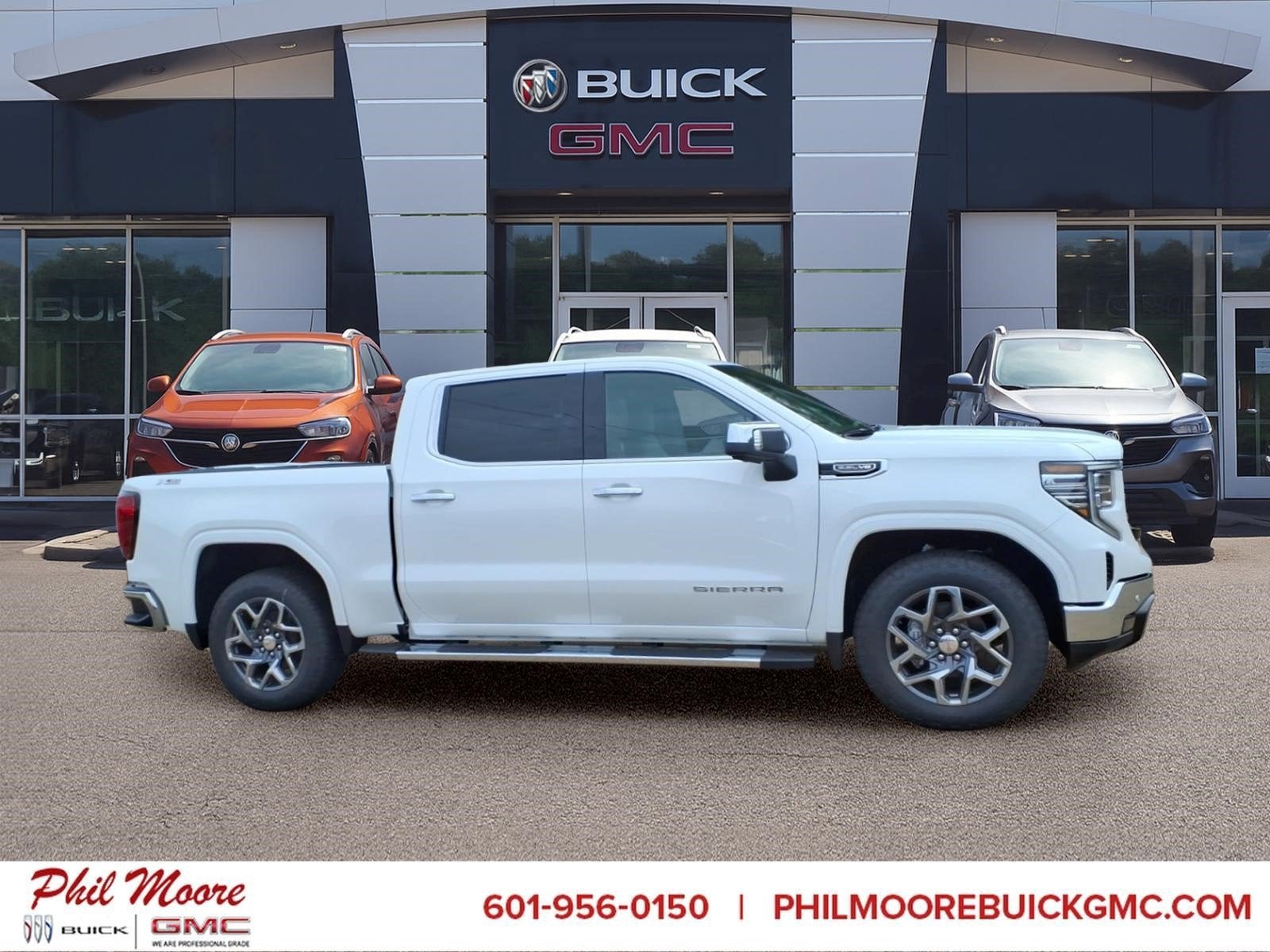 2026 GMC Sierra 1500 SLT in Summit White — front three-quarter view
