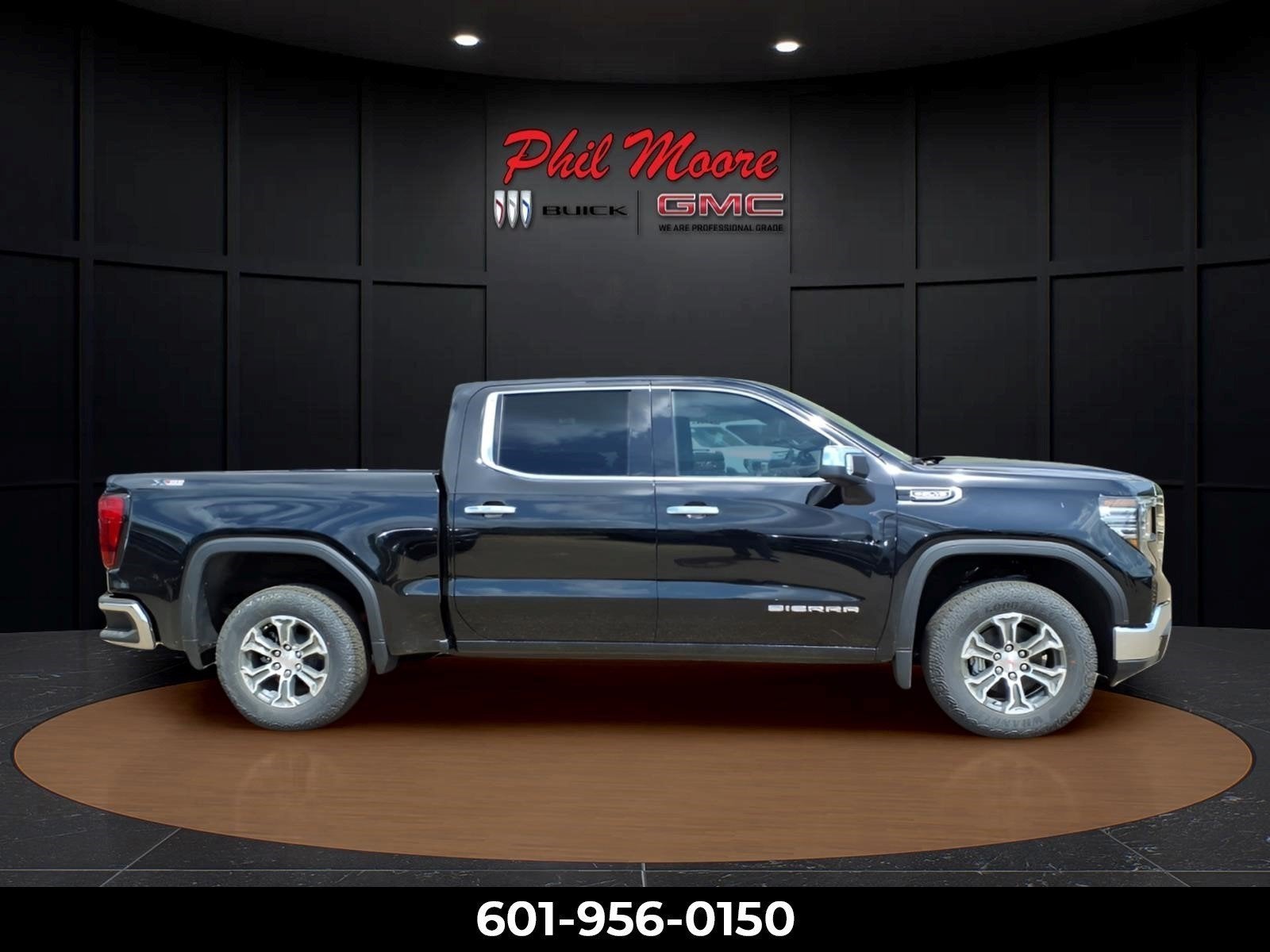 2026 GMC Sierra 1500 SLT in Onyx Black — front three-quarter view