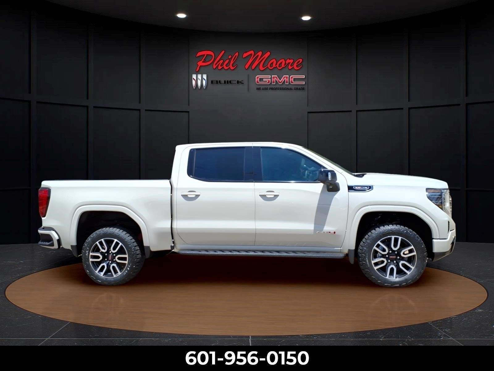 2026 GMC Sierra 1500 AT4 in Coastal Dune — front three-quarter view