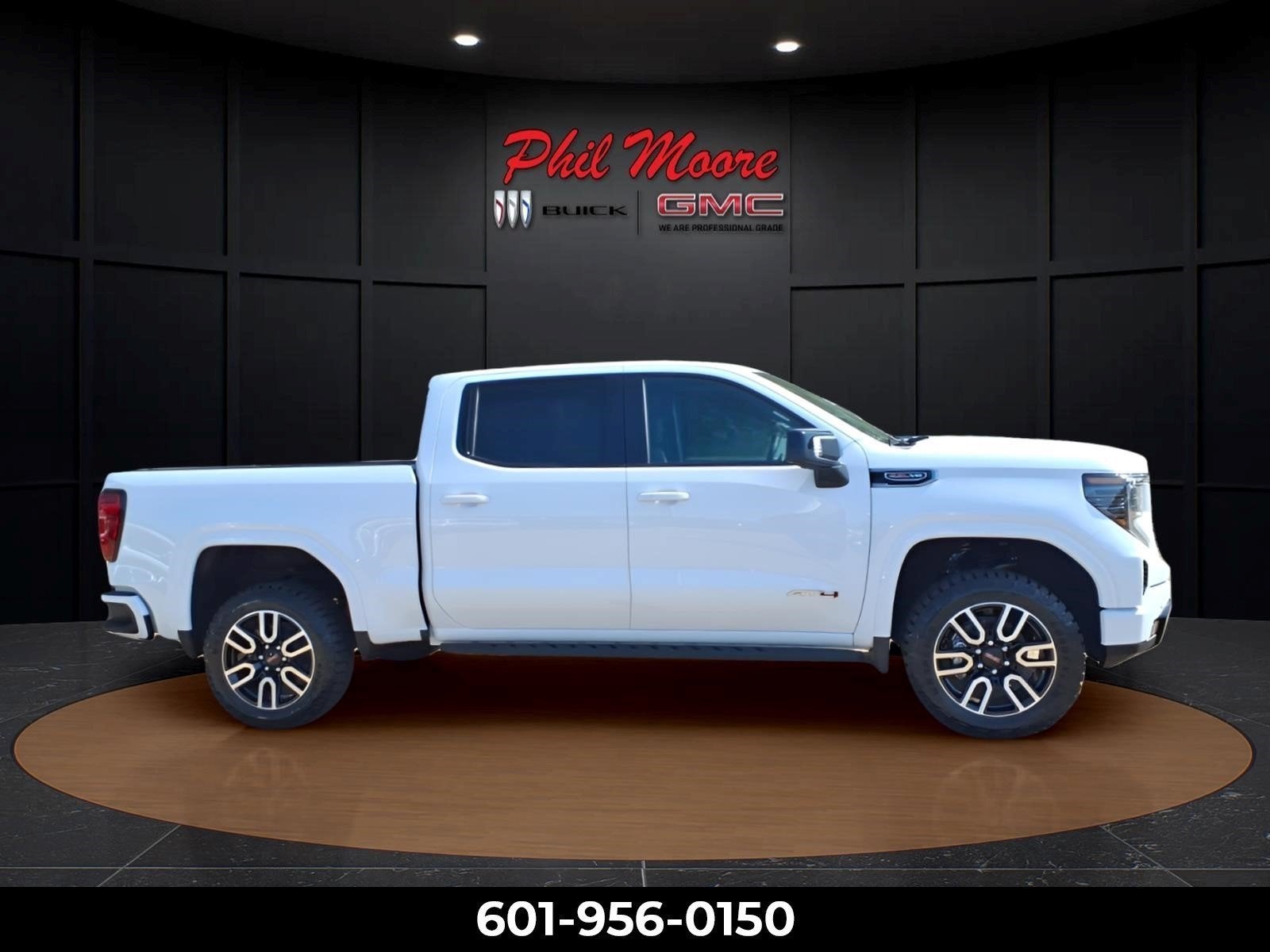 2026 GMC Sierra 1500 AT4 in Summit White — front three-quarter view