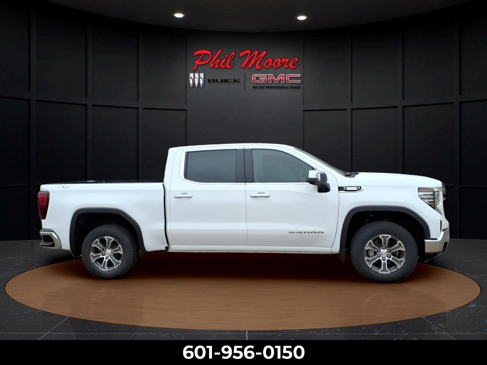 2026 GMC Sierra 1500 SLT in Summit White — front three-quarter view