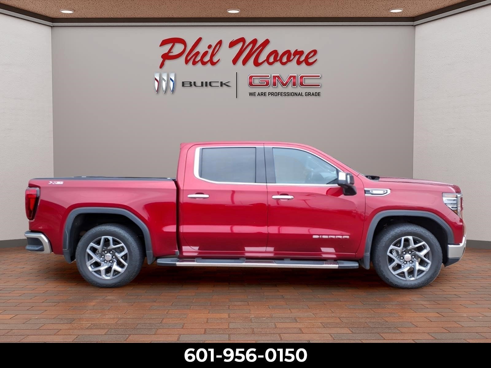 2024 GMC Sierra 1500 SLT in Volcanic Red Tintcoat — front three-quarter view
