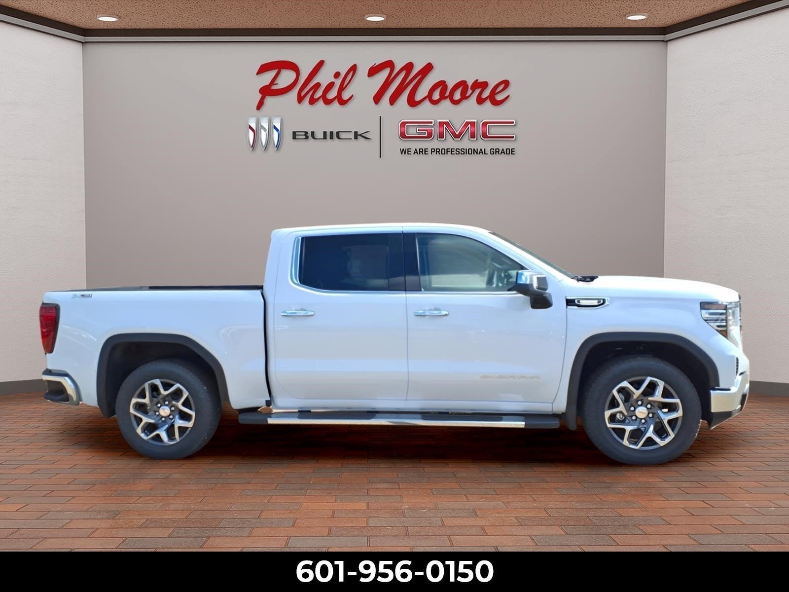2026 GMC Sierra 1500 SLT in Glacier White Tricoat — front three-quarter view