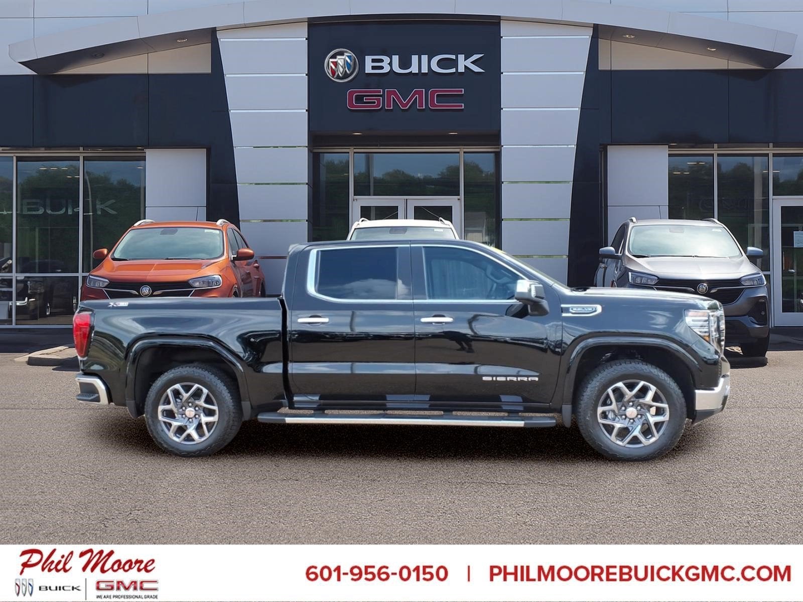 2026 GMC Sierra 1500 SLT in Onyx Black — front three-quarter view