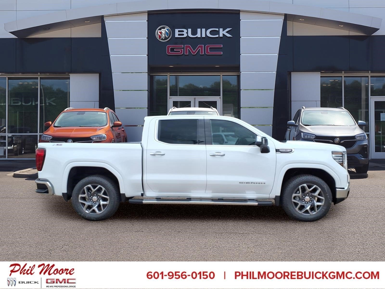 2026 GMC Sierra 1500 SLT in Summit White — front three-quarter view