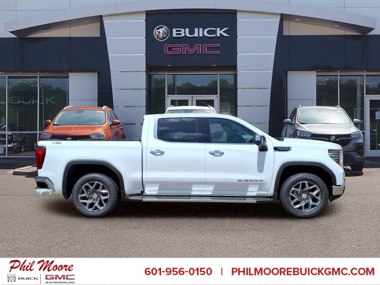2026 GMC Sierra 1500 SLT in Summit White — front three-quarter view