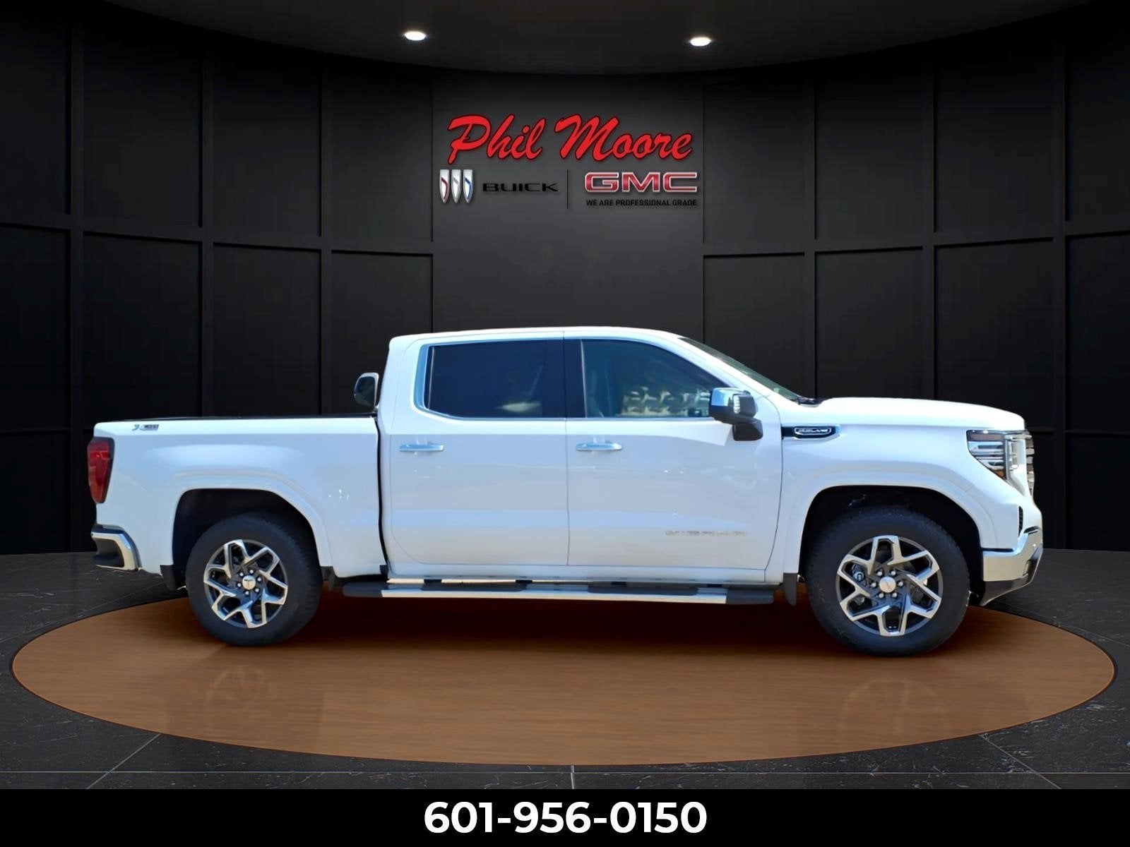2026 GMC Sierra 1500 SLT in Summit White — front three-quarter view