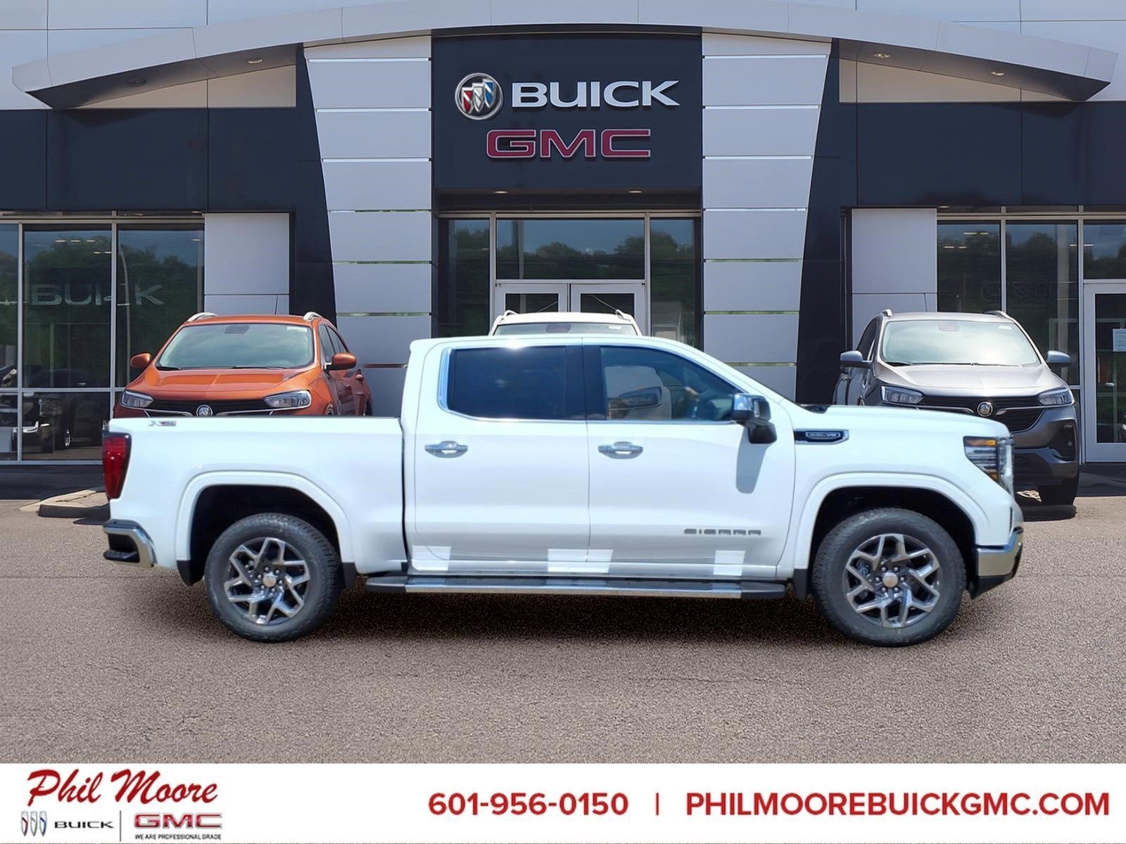 2026 GMC Sierra 1500 SLT in Summit White — front three-quarter view