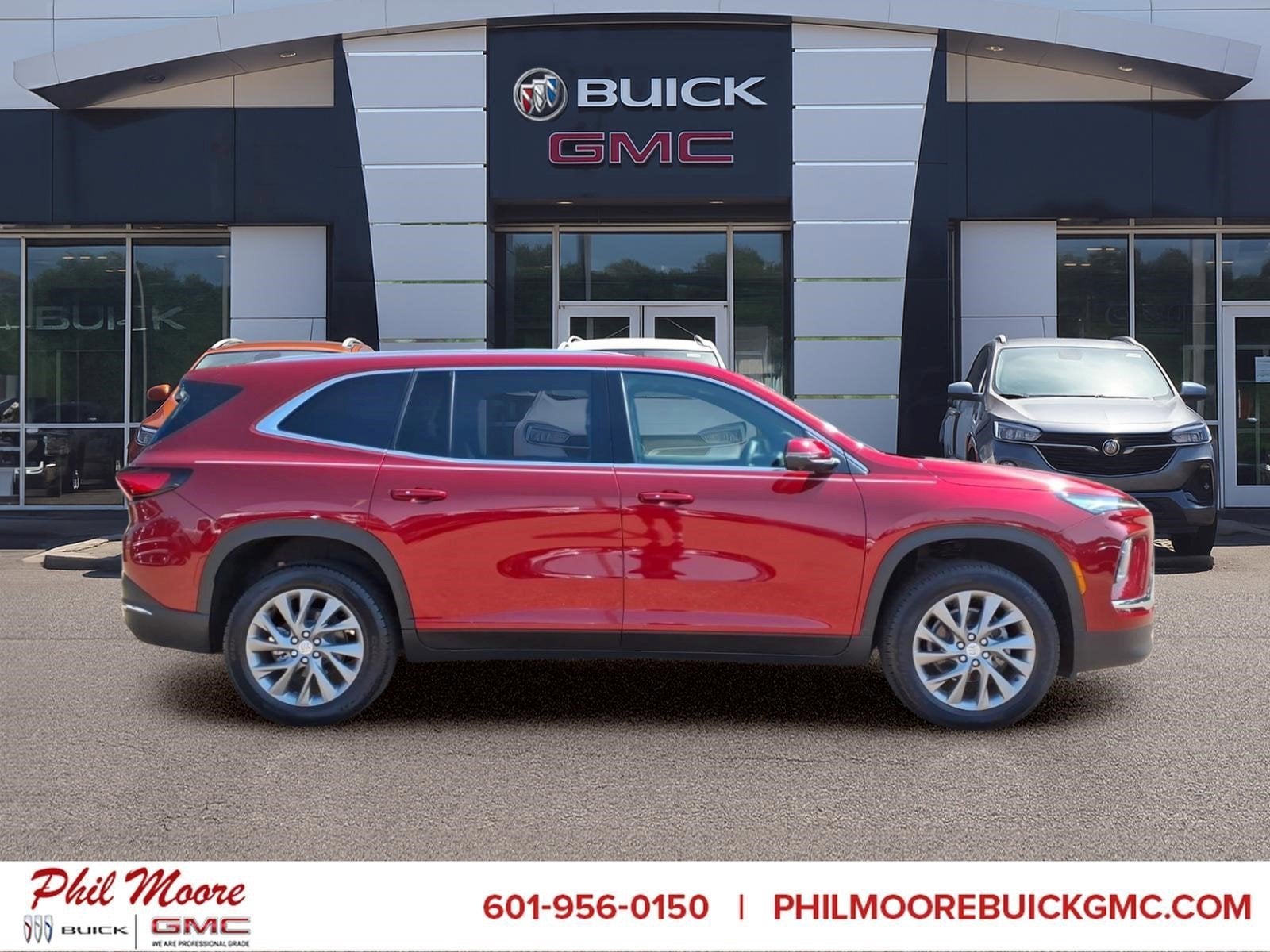2026 Buick Enclave Preferred in Cherry Red Tintcoat — front three-quarter view