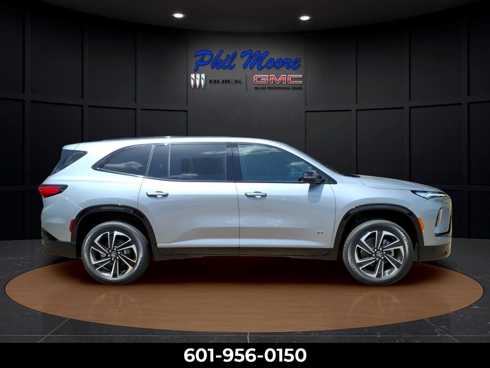 2026 Buick Enclave Sport Touring in Moonstone Gray Metallic — front three-quarter view