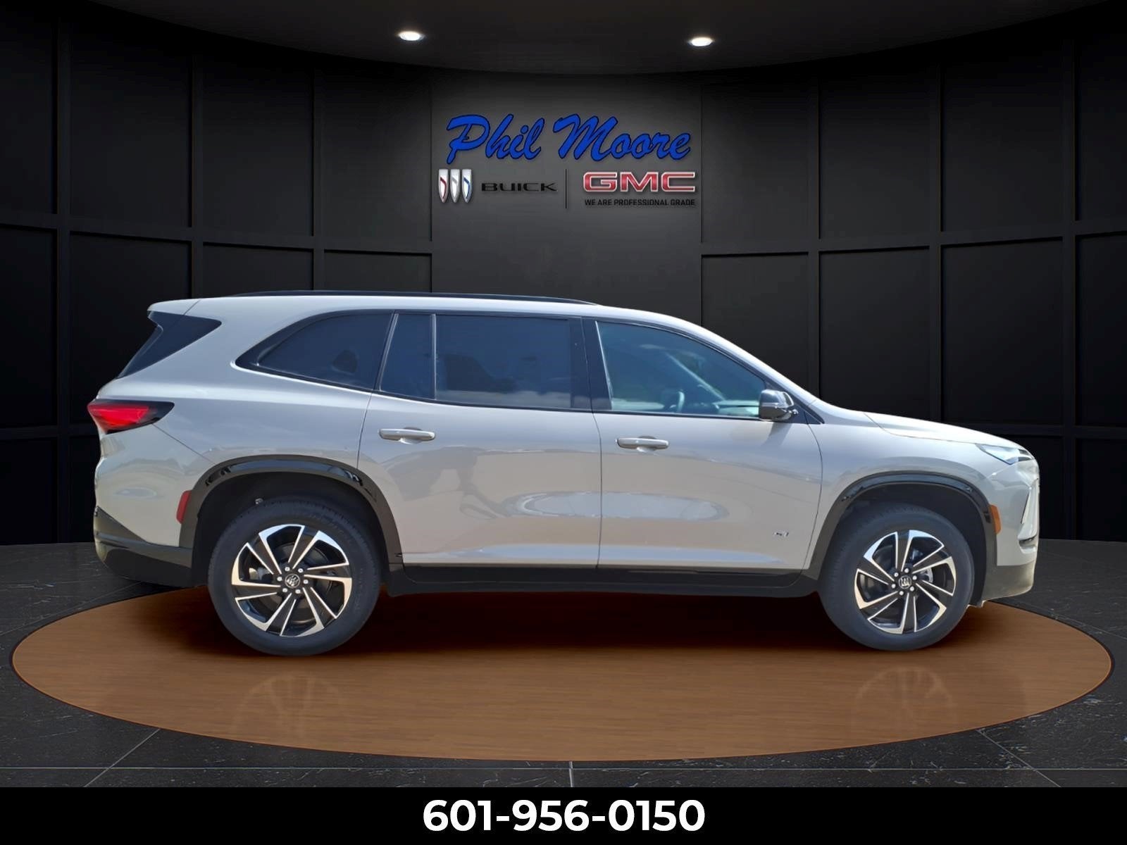 2026 Buick Enclave Sport Touring in Stone Metallic — front three-quarter view