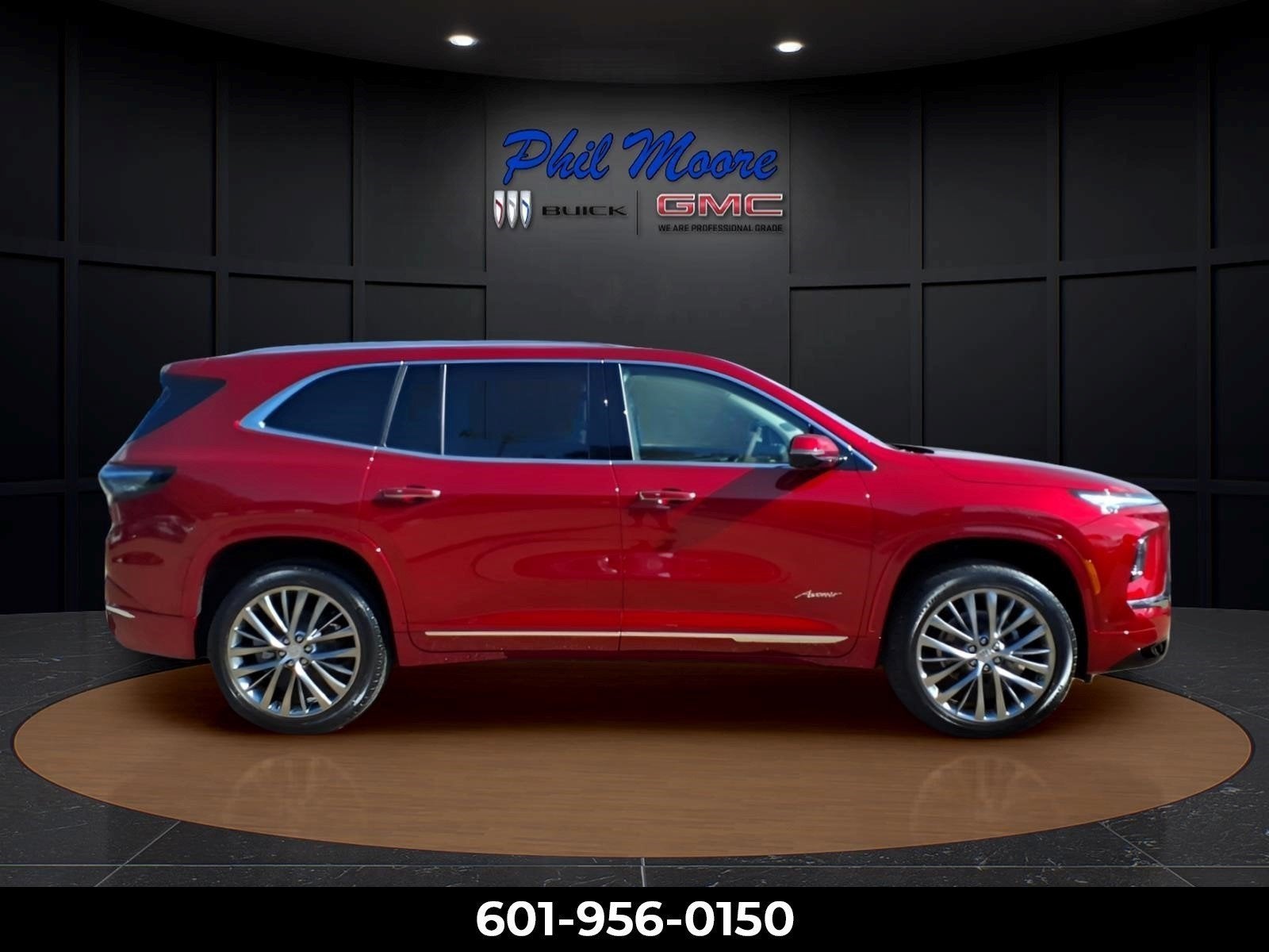2026 Buick Enclave Avenir in Cherry Red Tintcoat — front three-quarter view